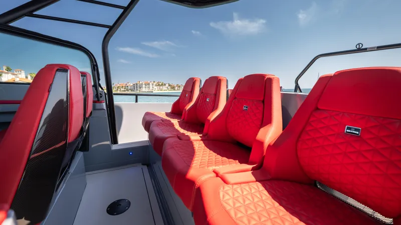 Slide: The Image of 2023 BRABUS Shadow 500 T-Top interior with luxurious red seating and sleek design. - 17