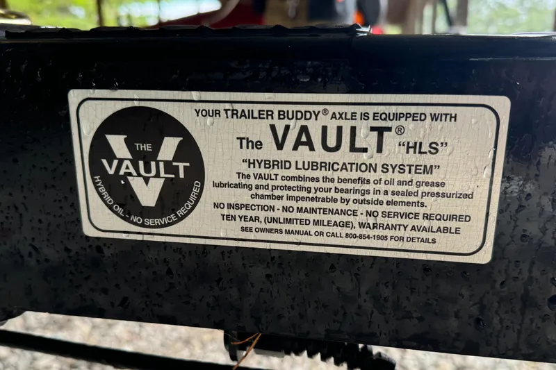 Slide: The Image of MasterCraft XT23 2022 trailer with The Vault Hybrid Lubrication System label. - 9