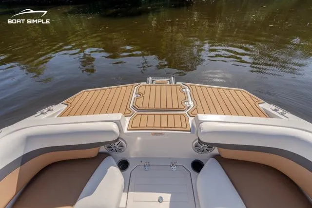 Slide: The Image of 2022 Starcraft SVX 191 OB boat interior with stylish seating and wood accents. - 10
