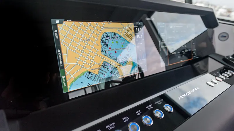 Slide: The Image of 2024 Axopar 37 XC Cross Cabin navigation display with detailed map interface. - 10