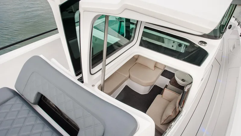 Slide: The Image of 2024 Axopar 37 XC Cross Cabin interior with seating and modern design. - 14