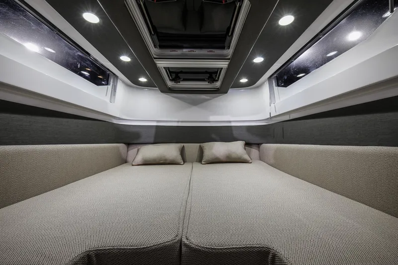 Slide: The Image of Luxurious interior of 2024 Axopar 37 XC Cross Cabin Aft Cabin with cozy bedding. - 16