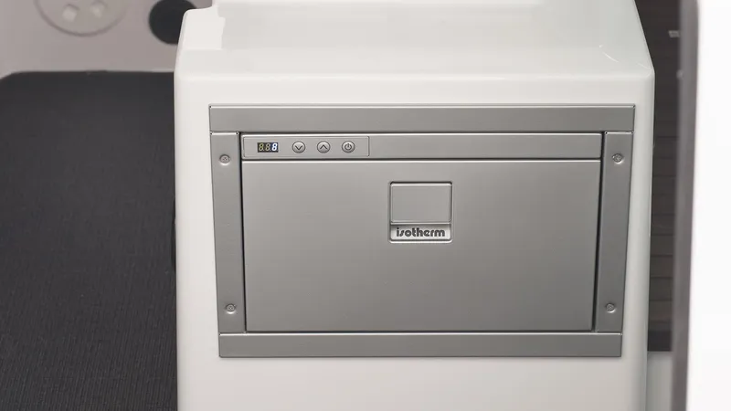 Slide: The Image of 2024 Axopar 37 XC Cross Cabin interior with built-in refrigerator. - 8