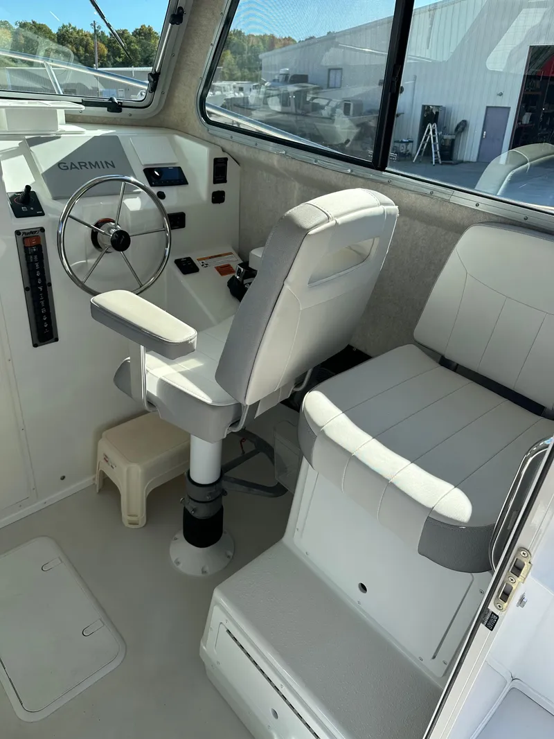 Slide: The Image of 2022 Parker 2520 XLD Sport Cabin interior with steering wheel and seating. - 11