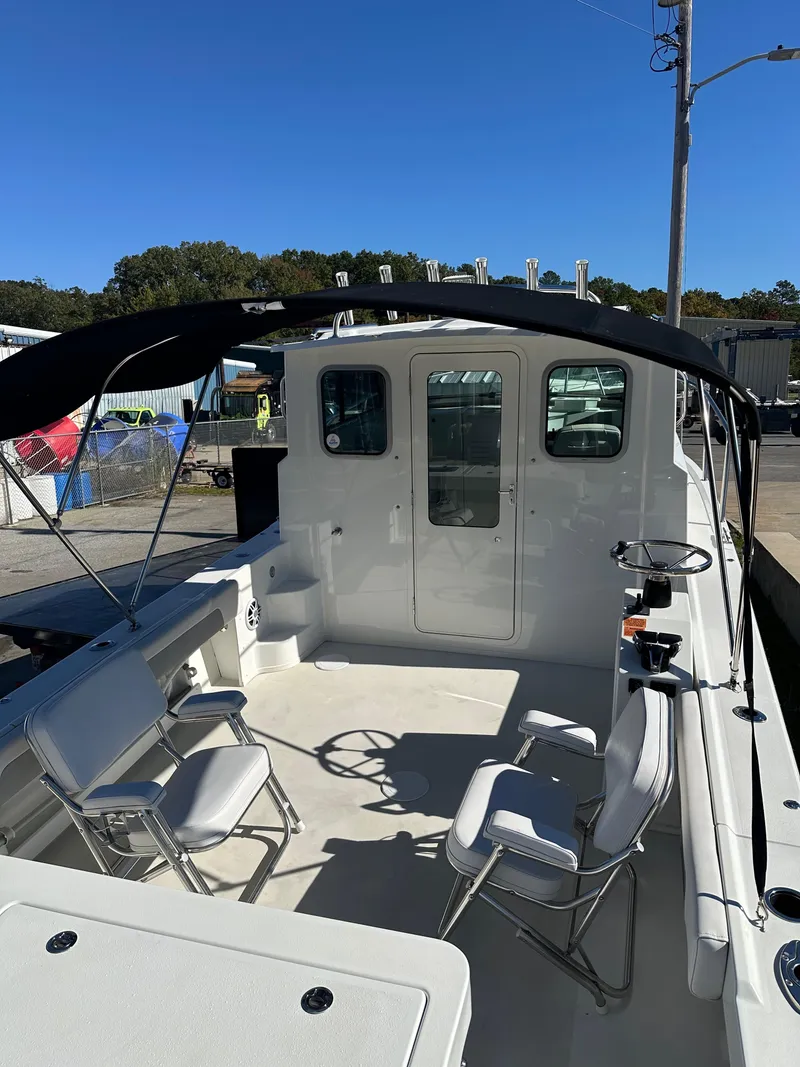 Slide: The Image of 2022 Parker 2520 XLD Sport Cabin boat with spacious deck and seating. - 5