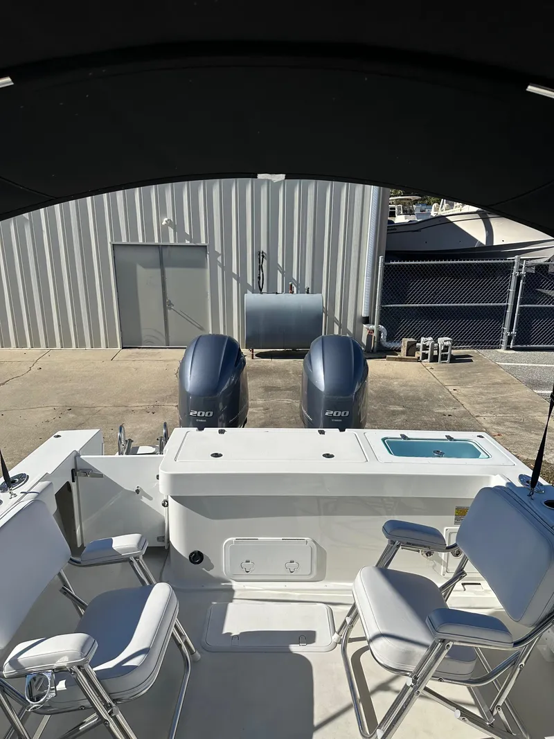 Slide: The Image of 2022 Parker 2520 XLD Sport Cabin boat with dual engines and seating. - 7