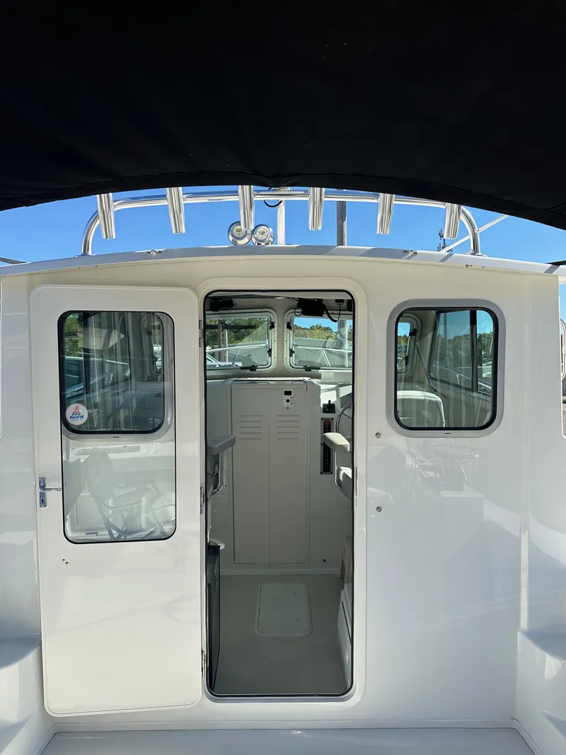 Slide: The Image of 2022 Parker 2520 XLD Sport Cabin boat interior view. - 9