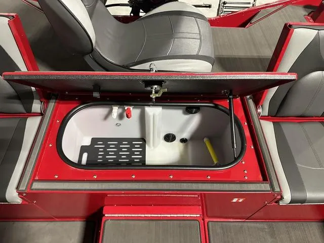 Slide: The Image of 2025 Lund 1875 Renegade SS boat interior with open storage compartment. - 10