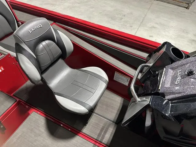 Slide: The Image of 2025 Lund 1875 Renegade SS boat interior with sleek seating and modern console. - 12
