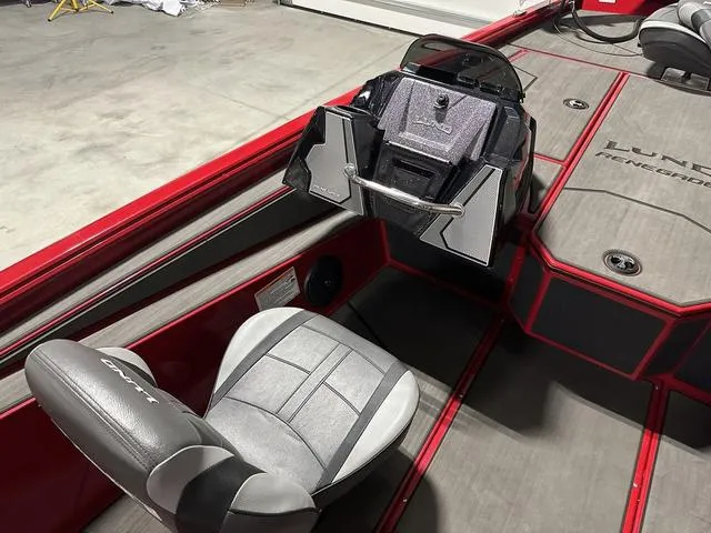 Slide: The Image of 2025 Lund 1875 Renegade SS boat interior with steering console and seating. - 13