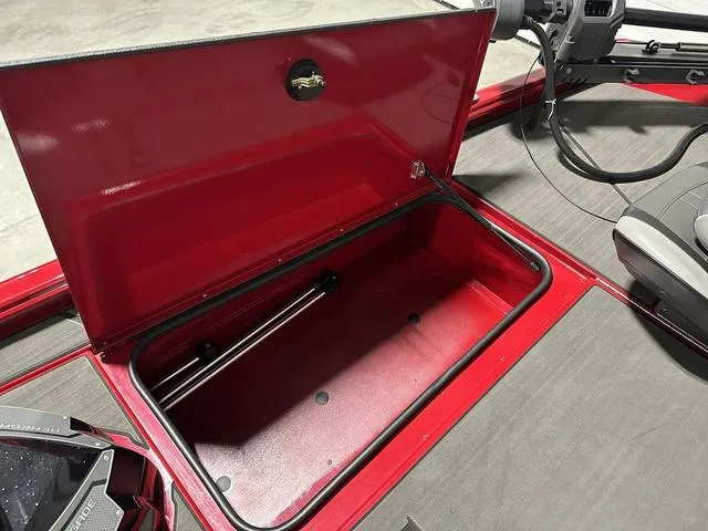 Slide: The Image of 2025 Lund 1875 Renegade SS boat with open red storage compartment. - 20