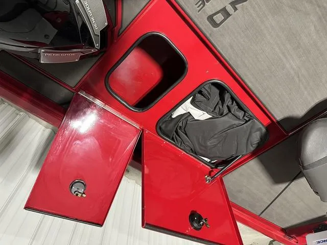 Slide: The Image of Red storage compartments on a 2025 Lund 1875 Renegade SS boat. - 21