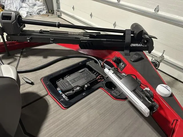 Slide: The Image of 2025 Lund 1875 Renegade SS boat deck with trolling motor and storage compartment. - 23