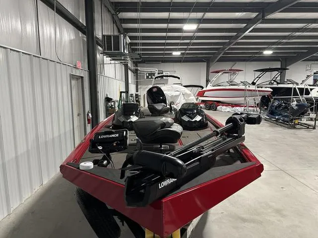 Slide: The Image of 2025 Lund 1875 Renegade SS boat in showroom, featuring Lowrance equipment. - 4