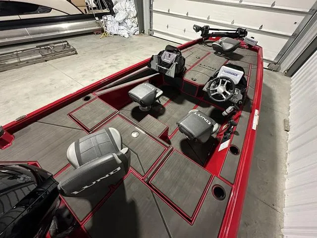 Slide: The Image of 2025 Lund 1875 Renegade SS fishing boat interior with seating and steering console. - 7