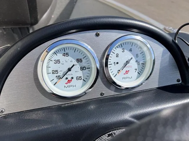Slide: The Image of 2024 Lund 1600 Fury SS dashboard with speedometer and tachometer gauges. - 10
