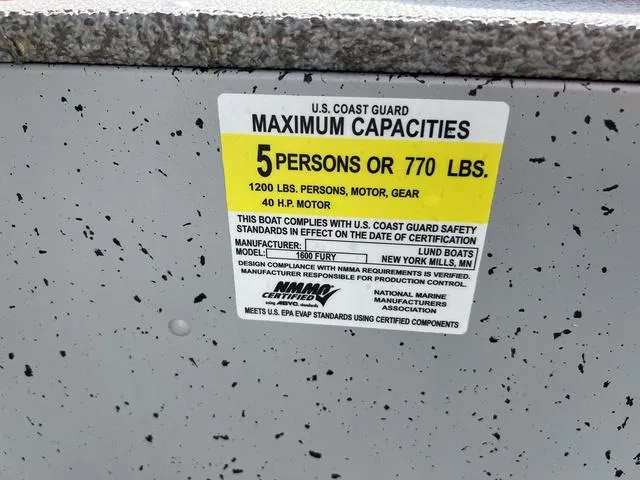 Slide: The Image of U.S. Coast Guard capacity label on 2024 Lund 1600 Fury SS boat, 5 persons or 770 lbs. - 14