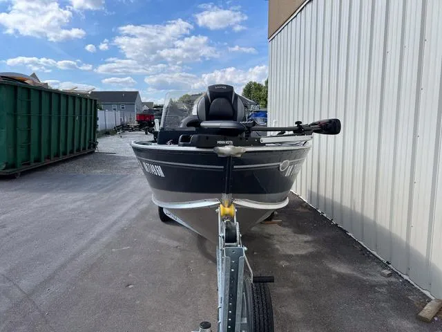 Slide: The Image of 2024 Lund 1600 Fury SS boat parked outdoors on a sunny day. - 3