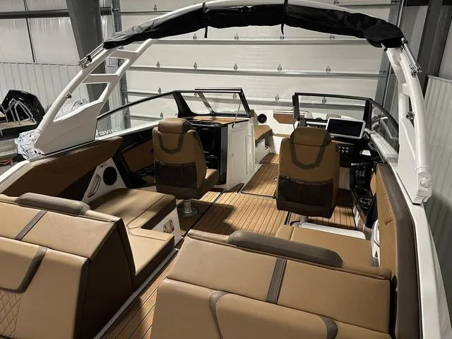 Slide: The Image of Interior of 2025 Yamaha Boats 222SD, featuring luxurious seating and modern dashboard. - 7