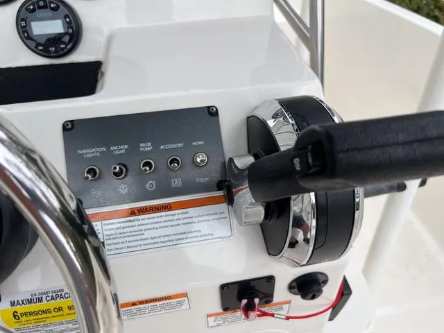 Slide: The Image of Close-up of 2021 Bayliner T18BAY boat control panel and throttle. - 14