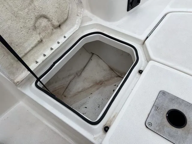 Slide: The Image of Open storage compartment on 2021 Bayliner T18BAY boat deck. - 21