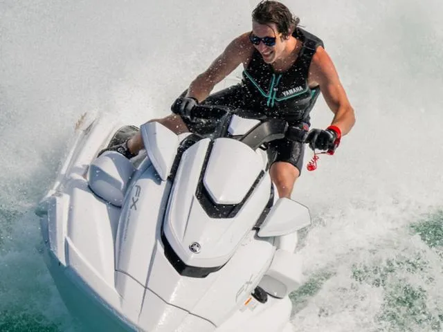 Slide: The Image of Man riding 2025 Yamaha Waverunner FX Cruiser SVHO on water, enjoying high-speed adventure. - 2