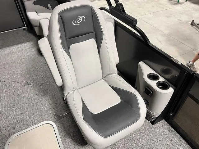 Slide: The Image of 2025 Barletta Aria A24QC boat seat with cup holders, featuring sleek gray upholstery. - 11