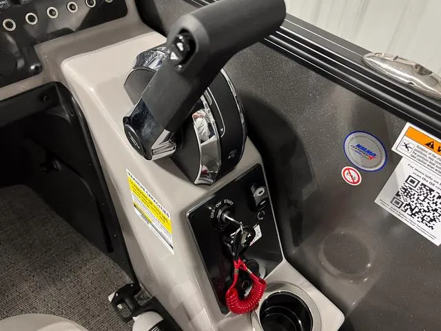 Slide: The Image of Control panel of 2025 Barletta Aria A24QC boat with throttle and ignition. - 17