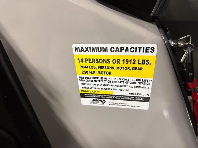 Slide: The Image of Barletta Boats Aria A24QC 2025 capacity label, 14 persons or 1912 lbs, 250 HP motor. - 18