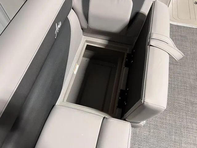 Slide: The Image of 2025 Barletta Aria A24QC boat seat with open storage compartment. - 25