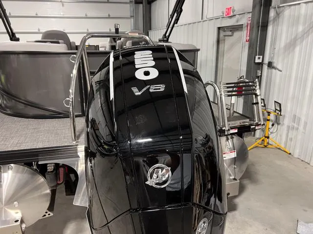 Slide: The Image of 2025 Barletta Aria A24QC boat with powerful V8 engine in a garage setting. - 4