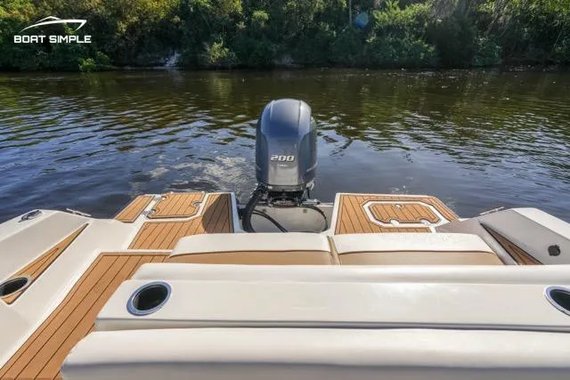 Slide: The Image of 2023 Starcraft SVX 231 OB DH boat with outboard motor on calm water. - 7