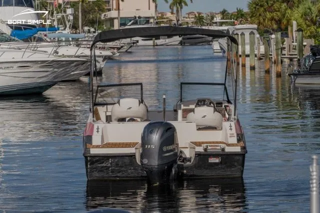 Slide: The Image of Starcraft SVX 190 DC 2022 boat docked in a marina with Yamaha engine. - 3
