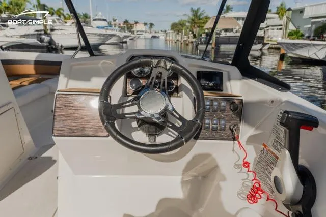 Slide: The Image of 2022 Starcraft SVX 190 DC boat dashboard with steering wheel and controls. - 7