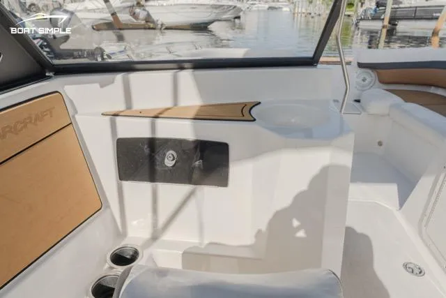 Slide: The Image of 2022 Starcraft SVX 190 DC boat interior with seating and cup holders. - 8