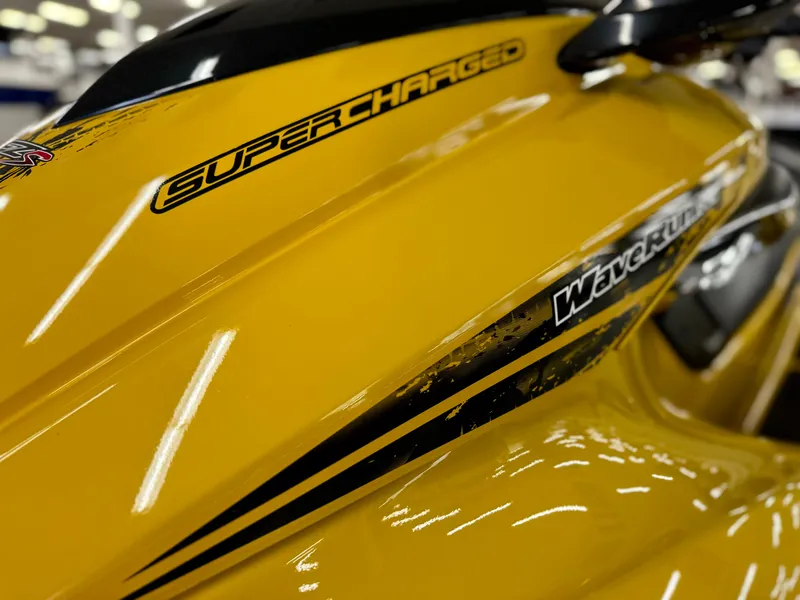 Slide: The Image of Close-up of a yellow 2014 Yamaha WaveRunner FZS, featuring "Supercharged" decal. - 11