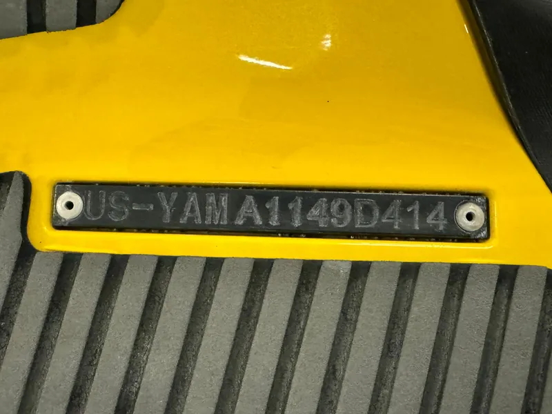 Slide: The Image of 2014 Yamaha WaveRunner FZS hull identification number on yellow surface. - 14