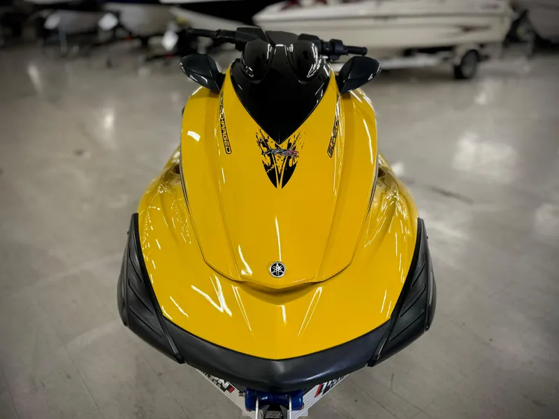 Slide: The Image of Yellow 2014 Yamaha WaveRunner FZS jet ski in showroom. - 2