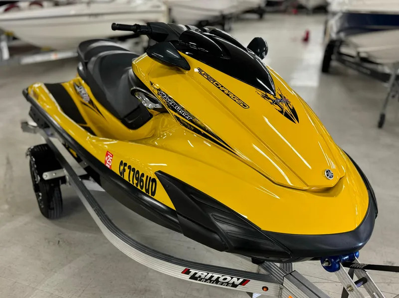 Slide: The Image of 2014 Yamaha WaveRunner FZS in vibrant yellow on a trailer. - 3