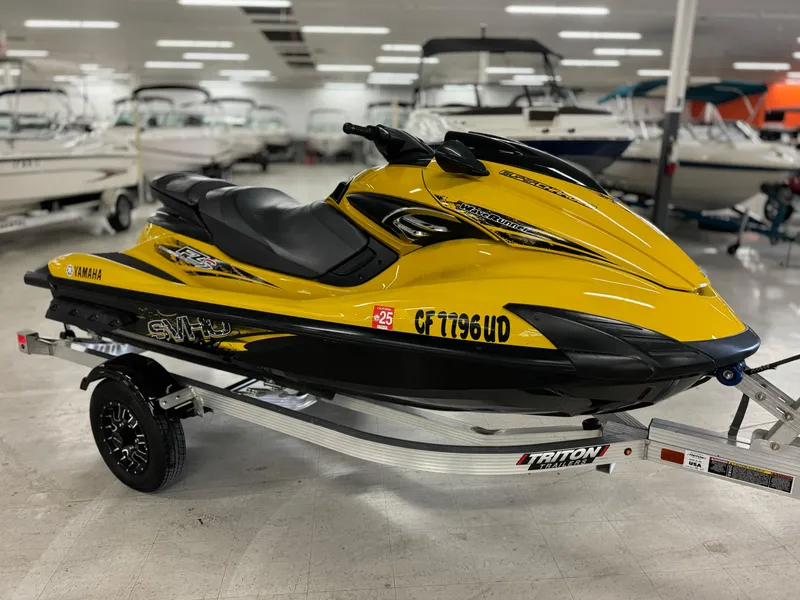 Slide: The Image of 2014 Yamaha WaveRunner FZS in showroom, yellow and black, on a trailer. - 4