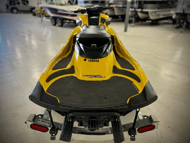 Slide: The Image of 2014 Yamaha WaveRunner FZS in showroom, rear view, yellow and black design. - 5