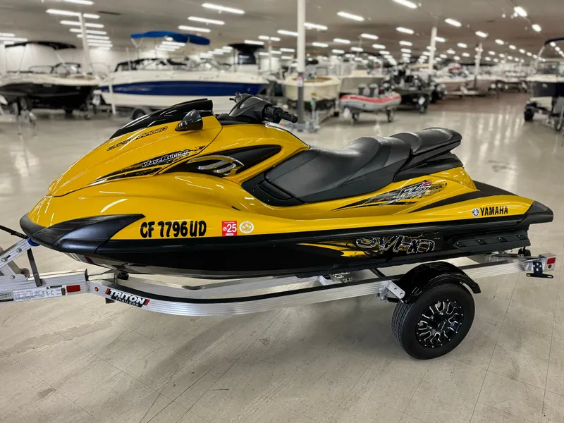 Slide: The Image of 2014 Yamaha WaveRunner FZS in showroom, yellow and black, on trailer. - 7