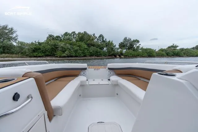 Slide: The Image of 2022 Starcraft SVX 211 OB boat interior with tan seating, scenic water view. - 10