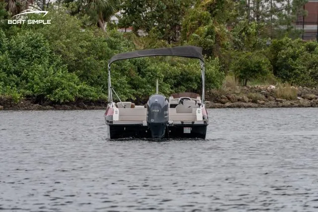 Slide: The Image of 2022 Starcraft SVX 211 OB boat on a calm lake with lush greenery. - 3