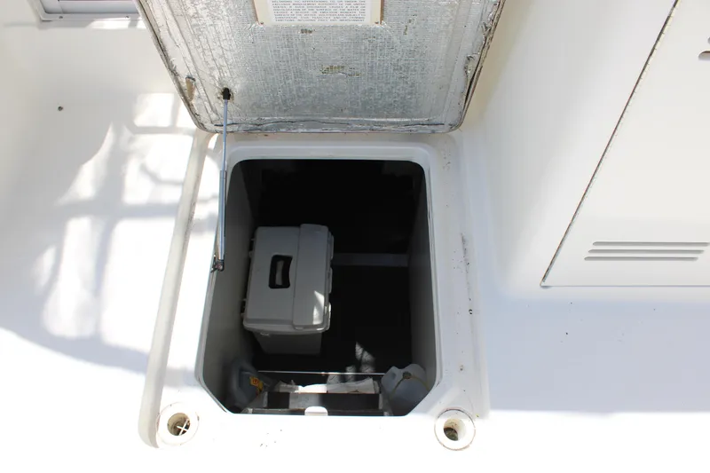 Slide: The Image of Open hatch on 2006 Silverton 42 Convertible boat, revealing storage compartment. - 12