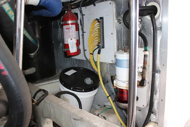 Slide: The Image of Engine room of 2006 Silverton 42 Convertible with fire extinguisher and wiring. - 28
