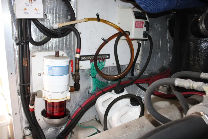 Slide: The Image of Engine room of a 2006 Silverton 42 Convertible with visible fuel filter and wiring. - 29