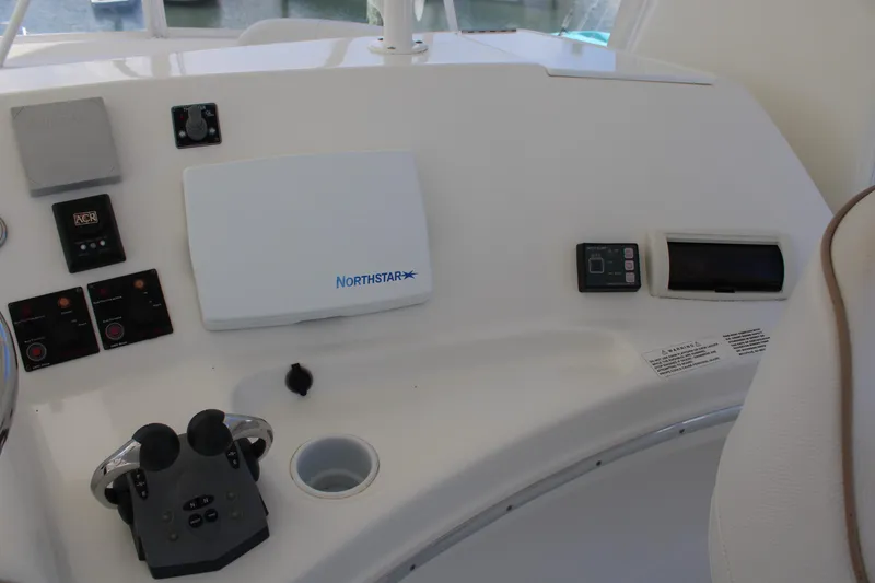 Slide: The Image of Control panel of a 2006 Silverton 42 Convertible yacht with navigation equipment. - 33