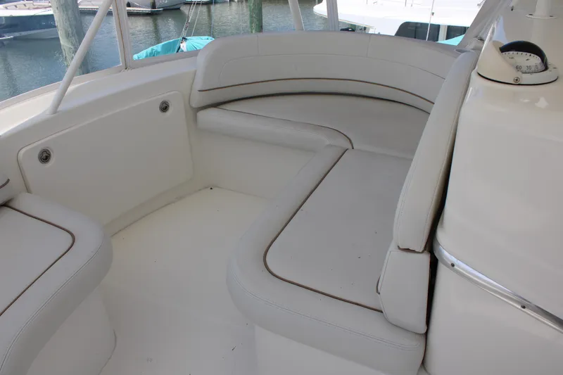 Slide: The Image of 2006 Silverton 42 Convertible boat interior with white cushioned seating. - 36