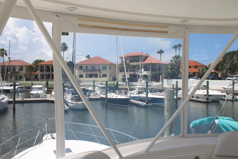 Slide: The Image of View from 2006 Silverton 42 Convertible yacht overlooking marina with boats and waterfront homes. - 38